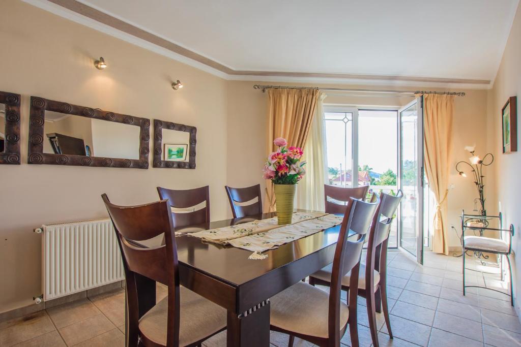 Dining room with table and balcony access